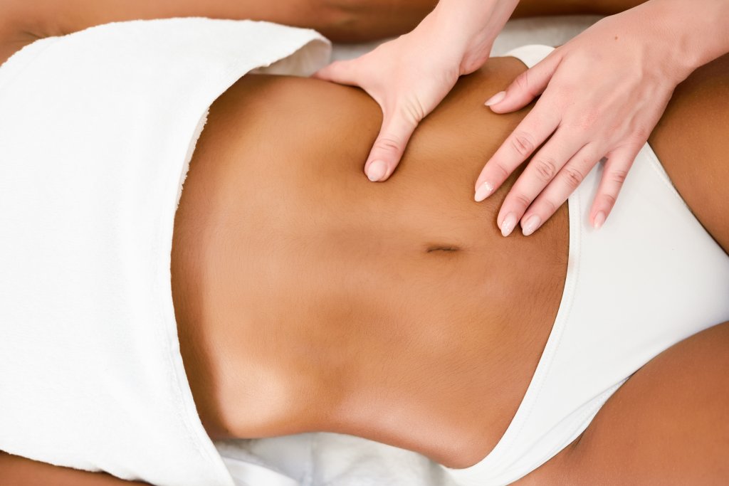 woman-receiving-abdomen-massage-in-spa-wellness-center.jpg