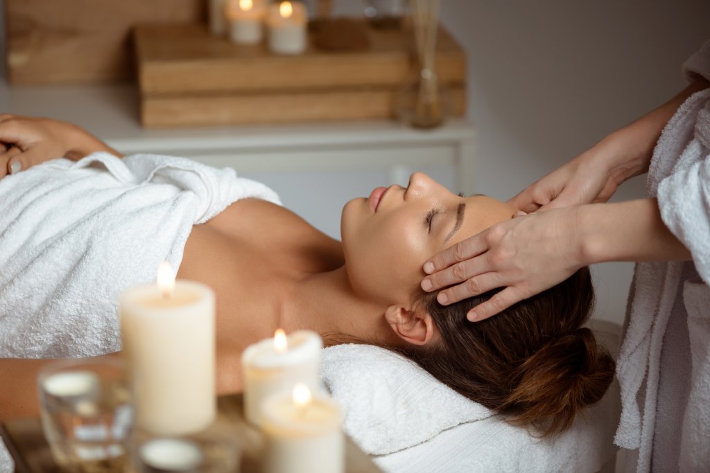 young-woman-having-face-massage-relaxing-in-spa-salon.jpg